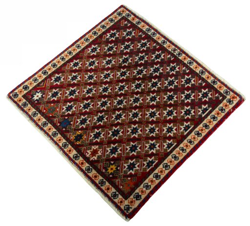 Corner detail of 2000s Shiraz rug showing border pattern and Wool pile