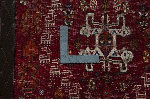Backside of handmade 2000s Shiraz rug showing knot structure and weave density