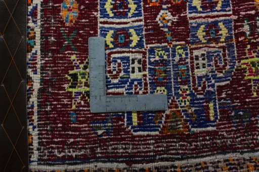 Backside of handmade 2000s Shiraz rug showing knot structure and weave density