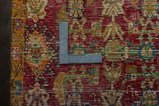Backside of handmade 2000s Shiraz rug showing knot structure and weave density
