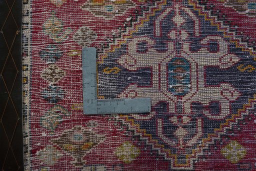 Backside of handmade 2000s Shiraz rug showing knot structure and weave density
