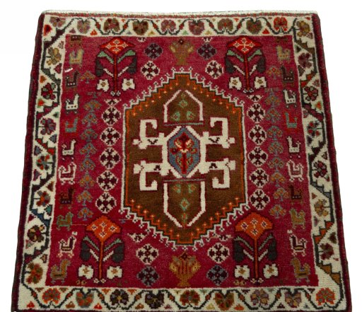 Surface texture of 2000s Shiraz rug with natural Wool and intricate pattern
