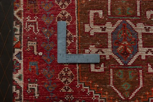 Backside of handmade 2000s Shiraz rug showing knot structure and weave density