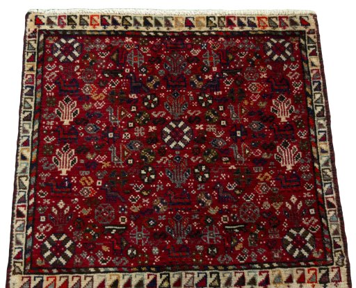 Surface texture of 2000s Shiraz rug with natural Wool and intricate pattern