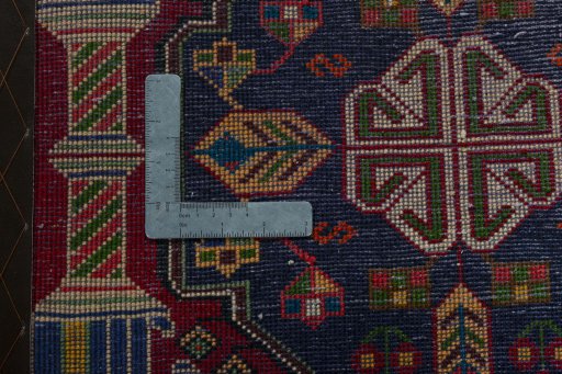 Backside of handmade 2000s Shiraz rug showing knot structure and weave density