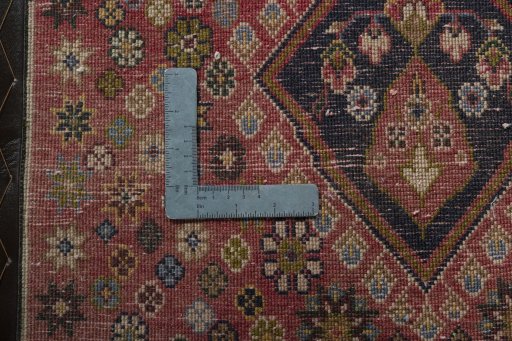 Backside of handmade 2000s Shiraz rug showing knot structure and weave density