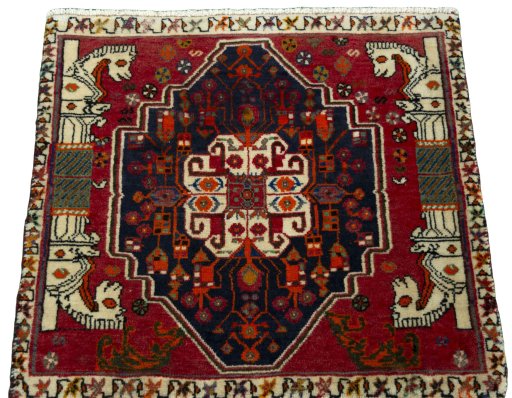Surface texture of 2000s Shiraz rug with natural Wool and intricate pattern