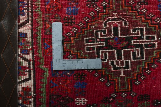 Backside of handmade 2000s Shiraz rug showing knot structure and weave density