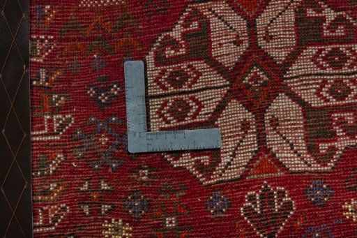 Backside of handmade 2000s Shiraz rug showing knot structure and weave density
