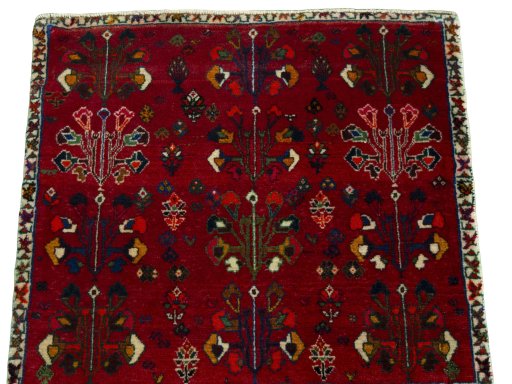Surface texture of 2000s Shiraz rug with natural Wool and intricate pattern