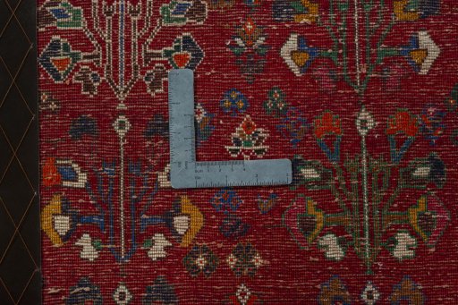 Backside of handmade 2000s Shiraz rug showing knot structure and weave density