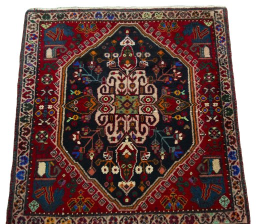 Surface texture of 2000s Shiraz rug with natural Wool and intricate pattern