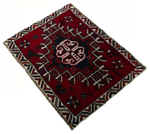 Corner detail of 2000s Shiraz rug showing border pattern and Wool pile