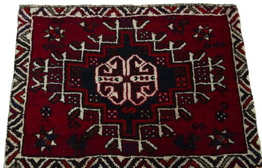 Surface texture of 2000s Shiraz rug with natural Wool and intricate pattern