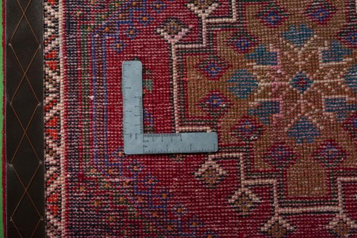 Backside of handmade 2000s Shiraz rug showing knot structure and weave density