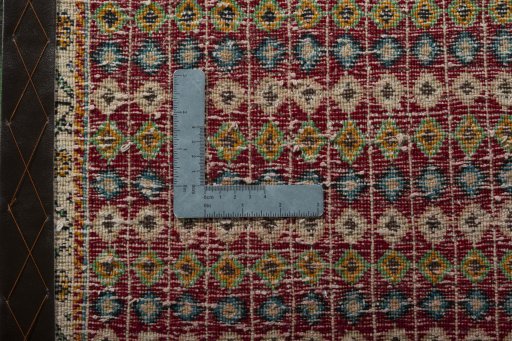 Backside of handmade 2000s Shiraz rug showing knot structure and weave density