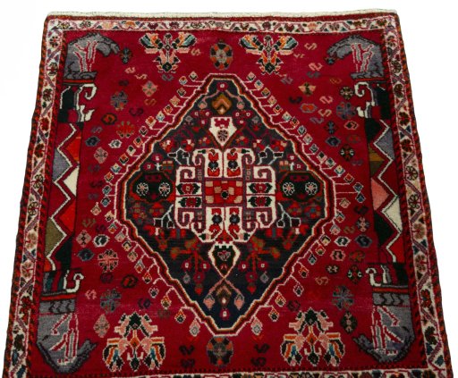 Surface texture of 2000s Shiraz rug with natural Wool and intricate pattern