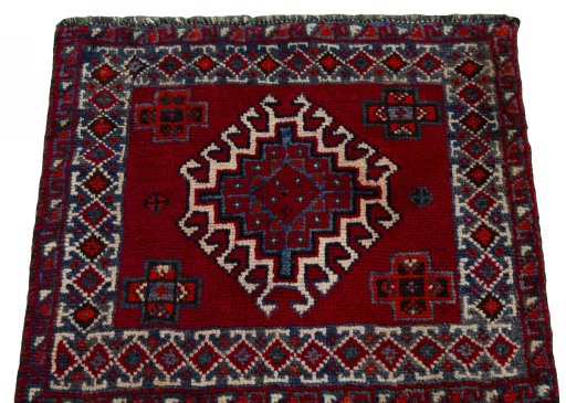 Surface texture of 2000s Shiraz rug with natural Wool and intricate pattern