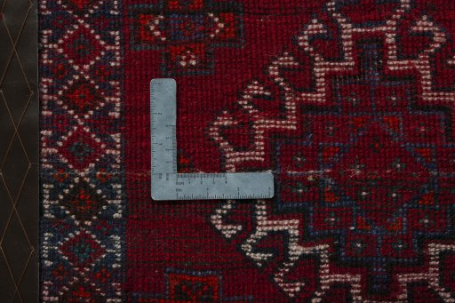 Backside of handmade 2000s Shiraz rug showing knot structure and weave density