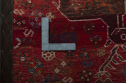 Backside of handmade 2000s Shiraz rug showing knot structure and weave density