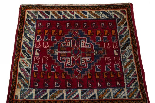 Surface texture of 2000s Shiraz rug with natural Wool and intricate pattern