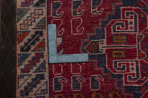 Backside of handmade 2000s Shiraz rug showing knot structure and weave density
