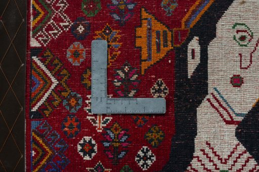 Backside of handmade 2000s Shiraz rug showing knot structure and weave density