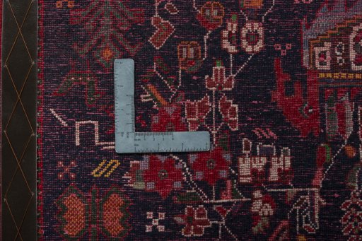 Backside of handmade 2000s Shiraz rug showing knot structure and weave density
