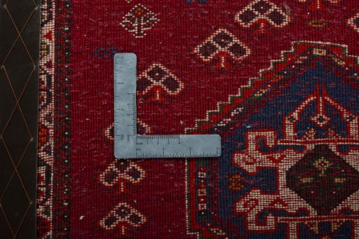Backside of handmade 2000s Shiraz rug showing knot structure and weave density