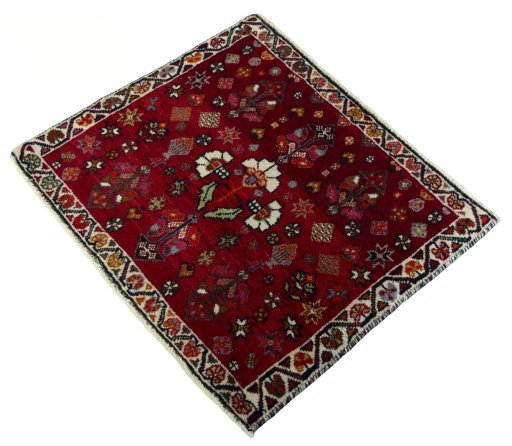 Corner detail of 2000s Shiraz rug showing border pattern and Wool pile