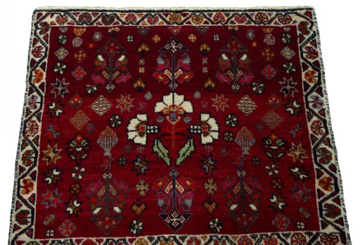 Surface texture of 2000s Shiraz rug with natural Wool and intricate pattern