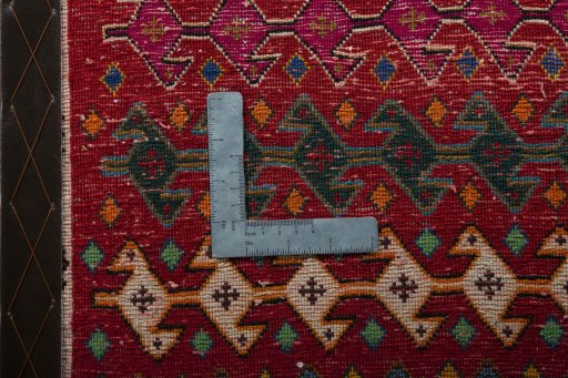 Backside of handmade 2000s Shiraz rug showing knot structure and weave density