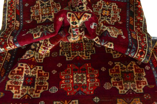 Corner detail of 2000s Shiraz rug showing border pattern and Wool pile