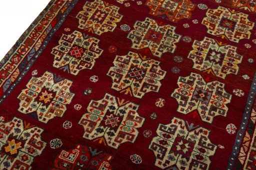 Backside of handmade 2000s Shiraz rug showing knot structure and weave density