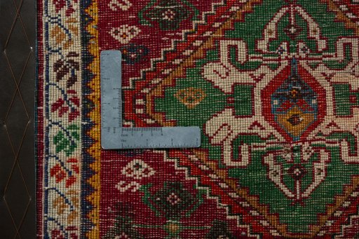Backside of handmade 2000s Shiraz rug showing knot structure and weave density