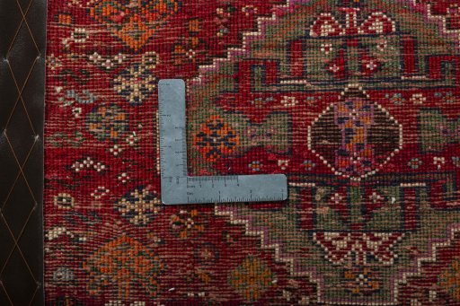 Backside of handmade 2000s Shiraz rug showing knot structure and weave density