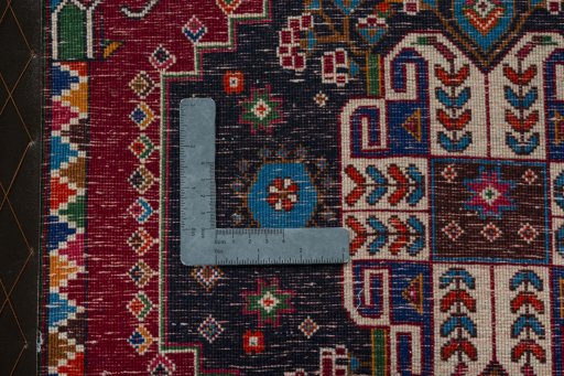Backside of handmade 2000s Shiraz rug showing knot structure and weave density