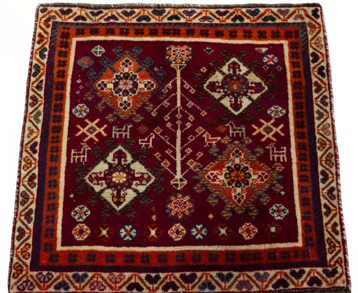 Surface texture of 2000s Shiraz rug with natural Wool and intricate pattern