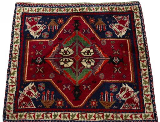 Surface texture of 2000s Shiraz rug with natural Wool and intricate pattern