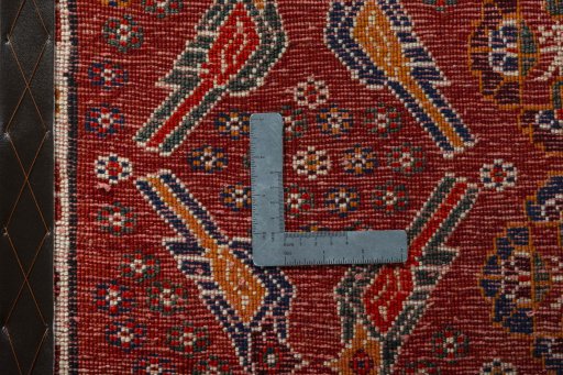 Backside of handmade 2000s Shiraz rug showing knot structure and weave density