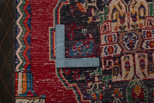 Backside of handmade 2000s Shiraz rug showing knot structure and weave density