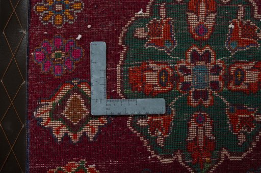 Backside of handmade 2000s Shiraz rug showing knot structure and weave density
