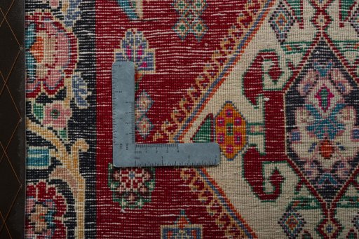 Backside of handmade 2000s Shiraz rug showing knot structure and weave density