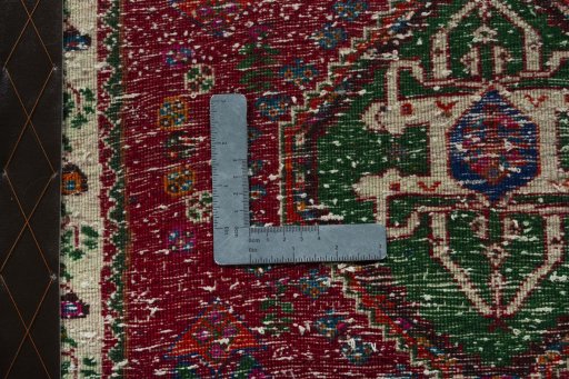 Backside of handmade 2000s Shiraz rug showing knot structure and weave density