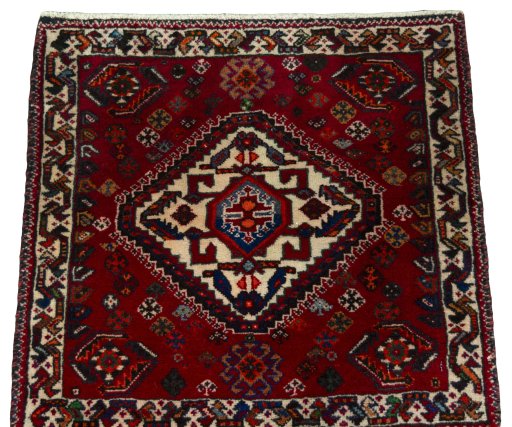 Surface texture of 2000s Shiraz rug with natural Wool and intricate pattern