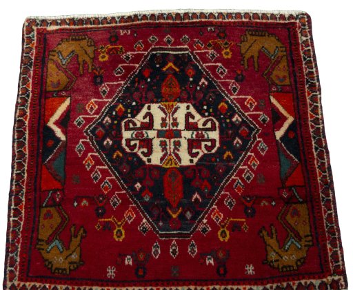 Surface texture of 2000s Shiraz rug with natural Wool and intricate pattern