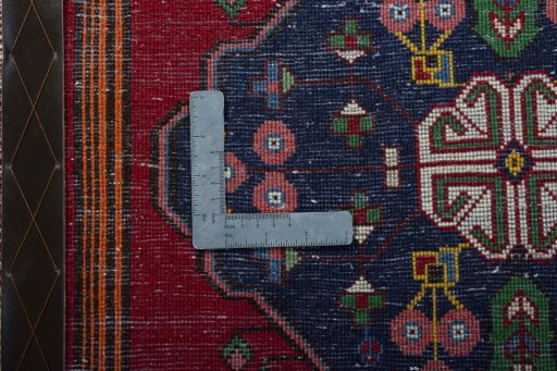 Backside of handmade 2000s Shiraz rug showing knot structure and weave density