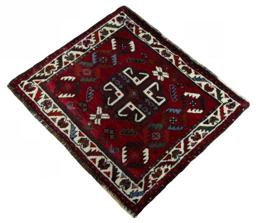 Corner detail of 2000s Shiraz rug showing border pattern and Wool pile