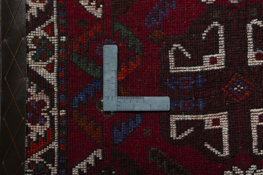 Backside of handmade 2000s Shiraz rug showing knot structure and weave density