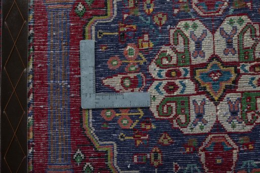 Backside of handmade 2000s Shiraz rug showing knot structure and weave density